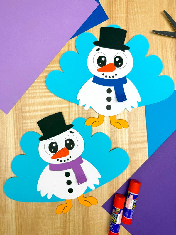 two turkey snowman disguise crafts on wood background with colored paper and glue sticks.