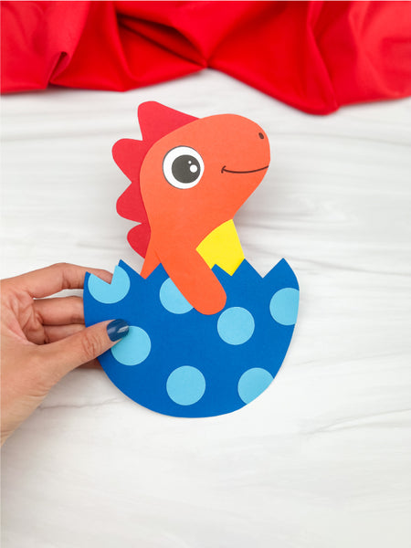 hand holding dinosaur egg craft