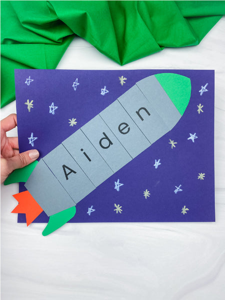 hand holding rocket name craft