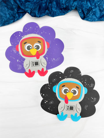 Two paper cutouts of turkeys in astronaut costumes on a white background.