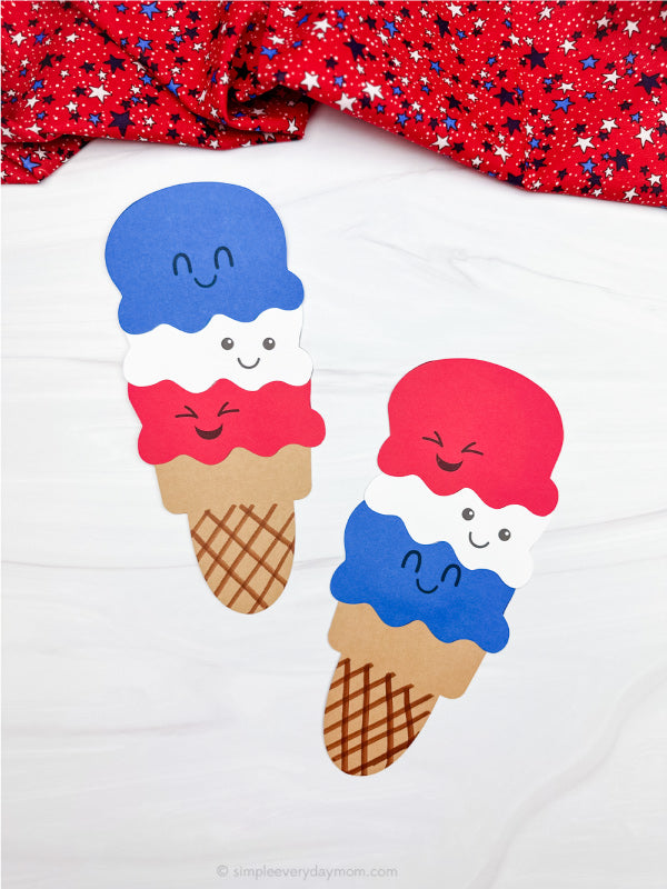Two red, white & blue ice cream crafts on white background with red fabric on top