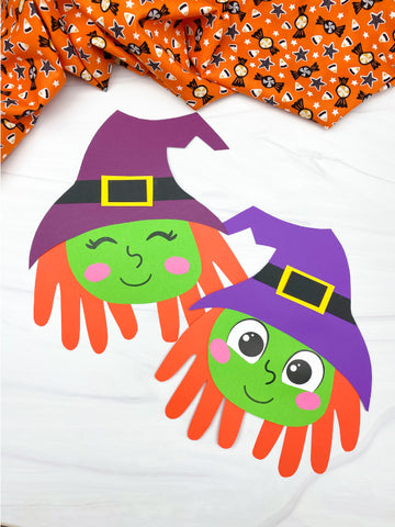 Handprint craft of two witches with colorful hats on a white background.