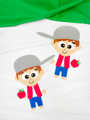 2 paper Johnny Appleseed crafts on white background with green fabric