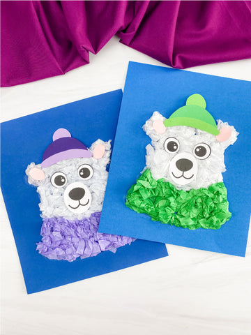 Two tissue paper polar bear crafts on white background with purple fabric
