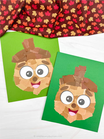 Two ripped paper acorn crafts on green paper with a leaf-patterned fabric in the background.