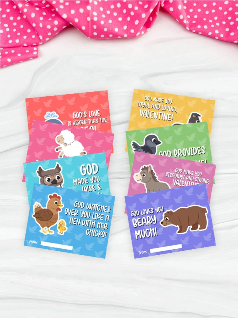 Set of colorful Valentine's Day cards with animal illustrations on a white surface.