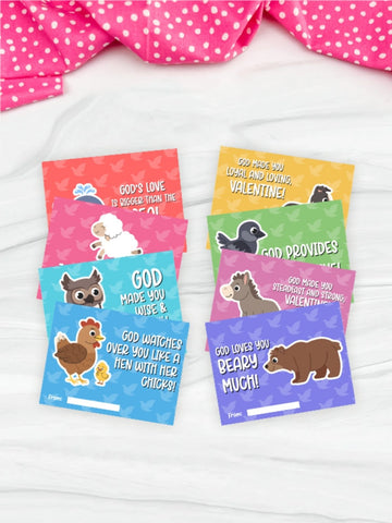 Set of colorful Valentine's Day cards with animal illustrations on a white surface.