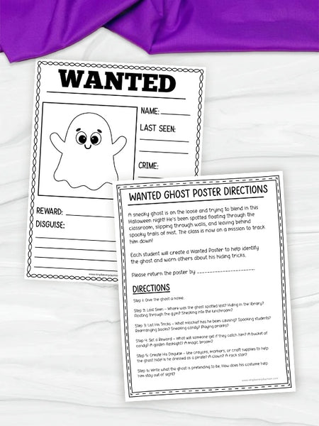 Two printable ghost-themed poster worksheets laid on a white surface, with one worksheet showing a black-and-white ghost 'WANTED' poster and the other showing the 'WANTED GHOST POSTER DIRECTIONS' page. A purple fabric corner is visible at the top left.