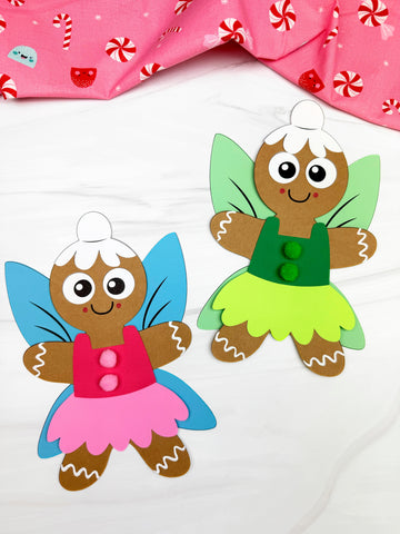 Two fairy gingerbread crafts on white background with pink fabric on top