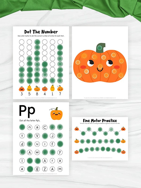 Four printable educational worksheets themed around pumpkin, displayed on a white marble surface with a green fabric napkin. The worksheets include 'Dot The Number', 'Pp Fine Motor Practice', and a pumpkin illustration sheet.