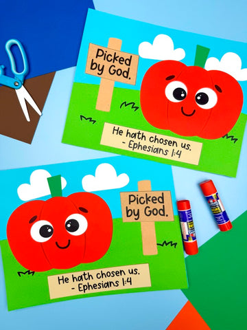 Children's Sunday school craft project with pumpkin faces and 'Picked by God' signs on a colorful background.