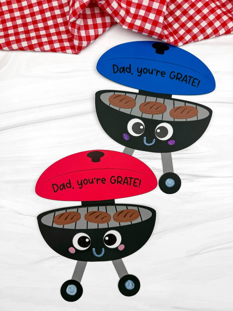 Two Father's Day grill crafts on white background with red and white checkered fabric on top
