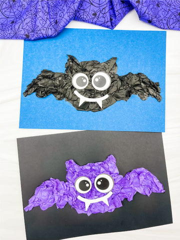 Two bat crafts made from crumpled paper on blue and black backgrounds.
