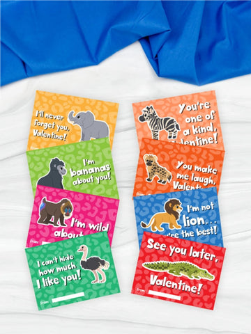 Set of colorful Valentine's Day cards with animal illustrations and text on a white surface.