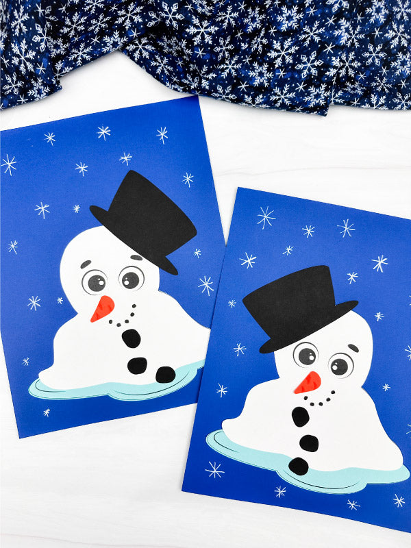 Two snowman crafts with a blue background and snowflake pattern.