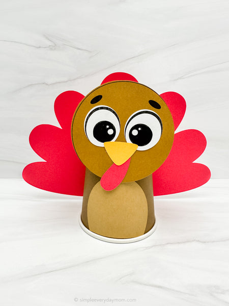 Paper cup turkey craft on a white background