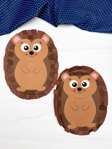 Two brown paper hedgehogs on a white background with a blue polka dot fabric in the background.