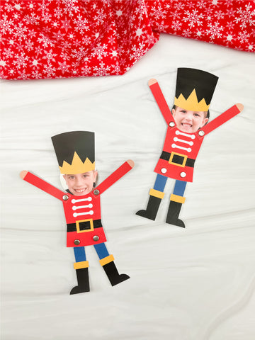 Two photo nutcracker crafts on white background with red snowflake fabric.