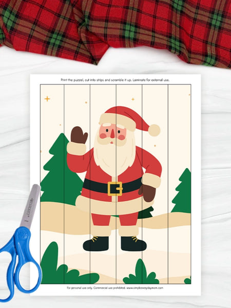 Christmas-themed puzzle with Santa Claus on a white background, accompanied by a pair of blue scissors.