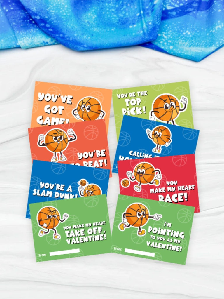Set of Valentine's Day cards with basketball-themed graphics on a white surface.