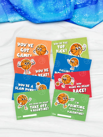 Set of Valentine's Day cards with basketball-themed graphics on a white surface.