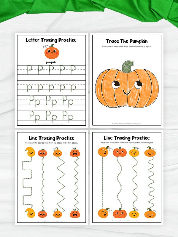 Four printable pumpkin-themed tracing worksheets arranged in a 2x2 grid on a white marble surface with a green fabric bow at the top. The worksheets include letter tracing practice, a pumpkin tracing activity, and line tracing practice with pumpkins.