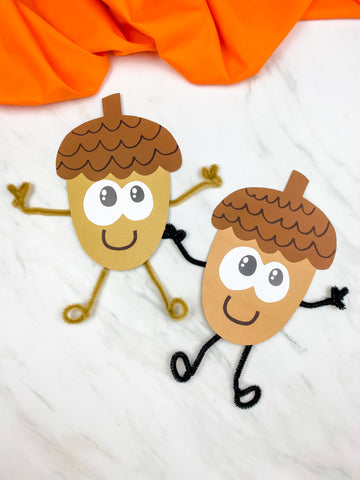 Two acorn-shaped characters with pipe cleaner limbs on a white background