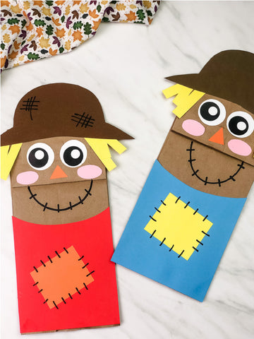 Two paper bag scarecrow crafts on a white background