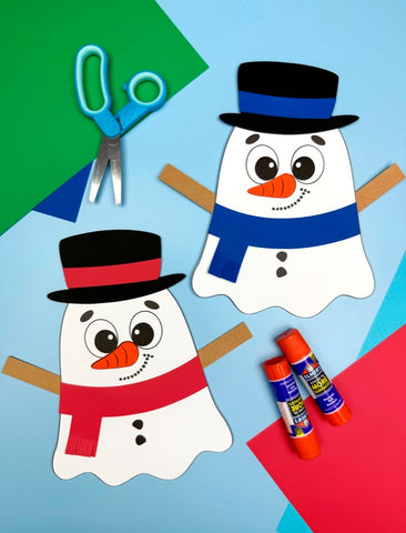 Two paper snowmen ghost disguises with hats and scarves, scissors, and glue sticks on a colorful background.