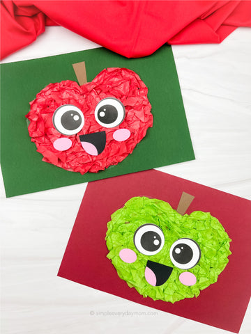Two torn paper apple crafts with faces on green and red paper.
