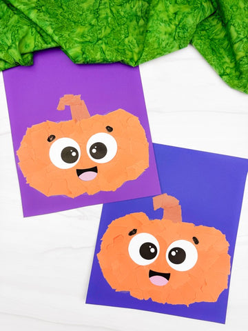 two torn paper pumpkin craft son white background with green fabric on top