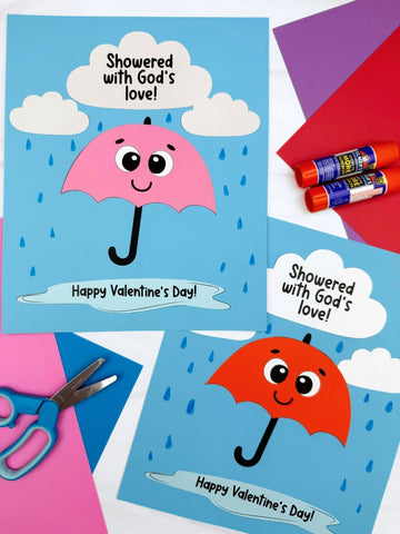 Two Valentine's Day crafts with umbrellas on a colorful background with markers and scissors.