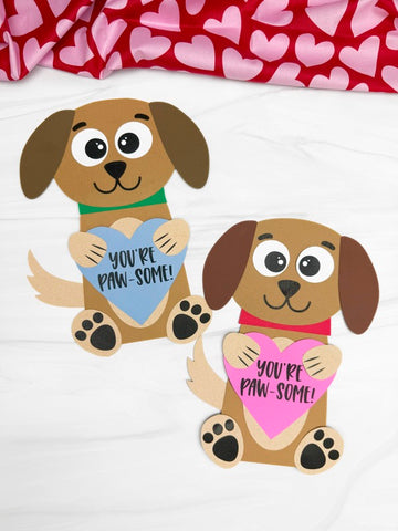 Two cartoon dogs holding hearts with 'You're Paw-some!' text on a white background.