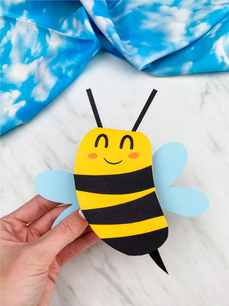 hand holding bee card craft