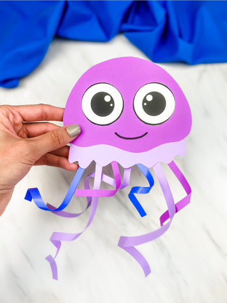 hand holding jellyfish kids' craft